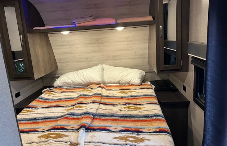 Queen sized walk around bed. Well lit and very comfortable.