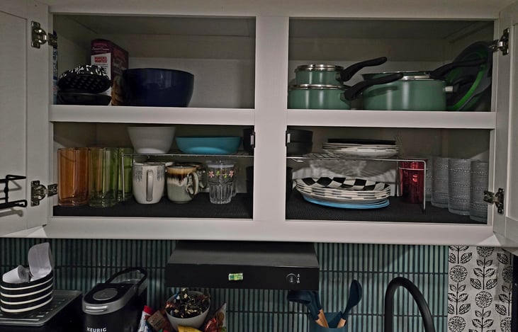 Kitchen is stocked with dinner plates, salad plates, bowls, coffee cups, drinking glasses, pots and pans, mixing bowls, mini waffle maker (unshown silverware, measuring cups, pizza cutter, knifes)