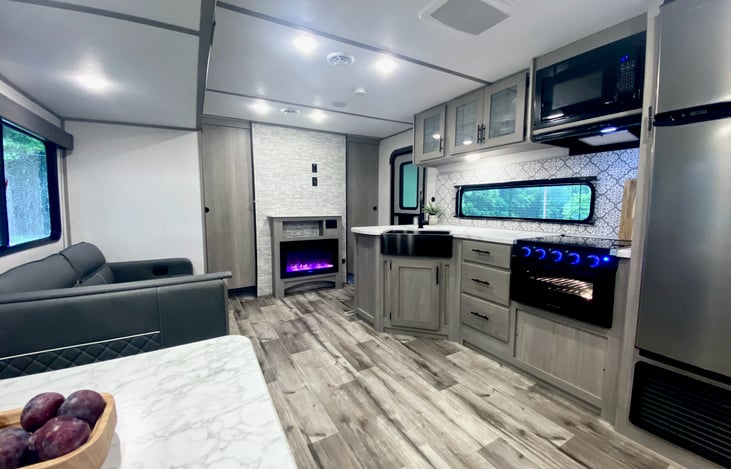 Beautiful, spacious kitchen... view from dining table.
Digital fireplace can actually the heat the entire camper!