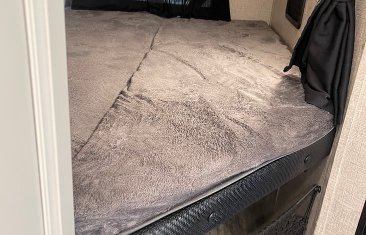 Bottom bunk with personal light, outlet, and USB port. (Top bunk has the same features)