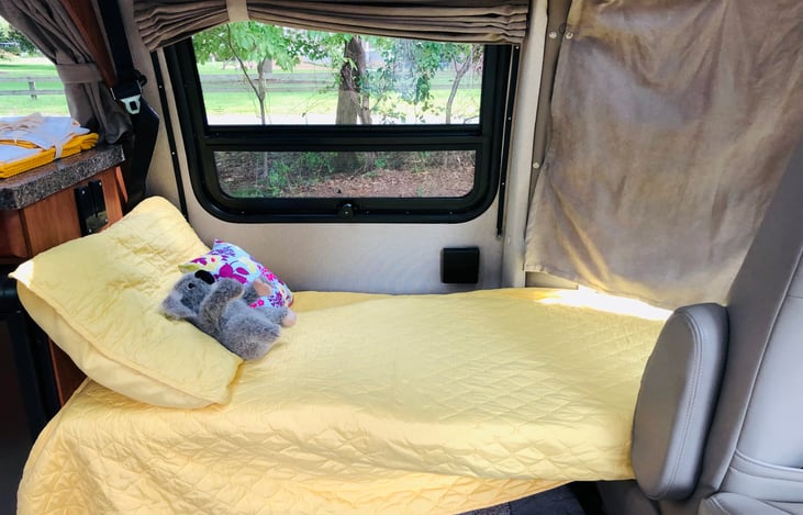 One of two cot-sized beds that can be made from the front seats - good size for kids.