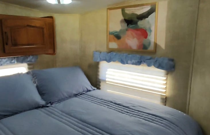 The Hot Tub Suite has a private bedroom w/ a queen-size bed with a 13-inch mattress