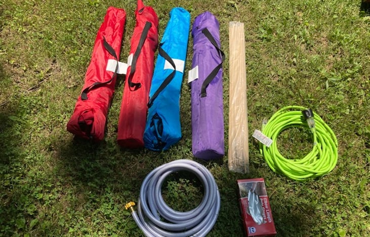 Included folding chairs, extension cord, water hose.