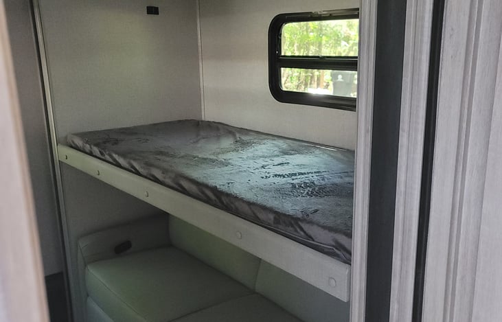 Twin bed above the recliners in the bunk house.