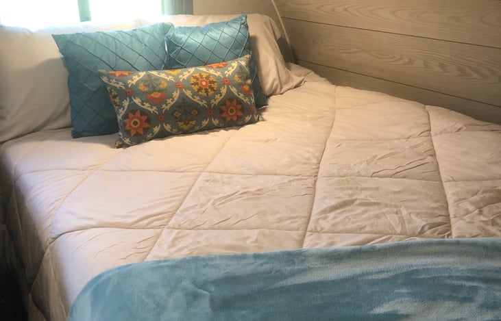 Queen bed with overhead and underbed storage