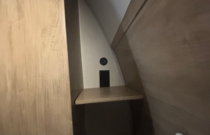 shelves by bed and outlets