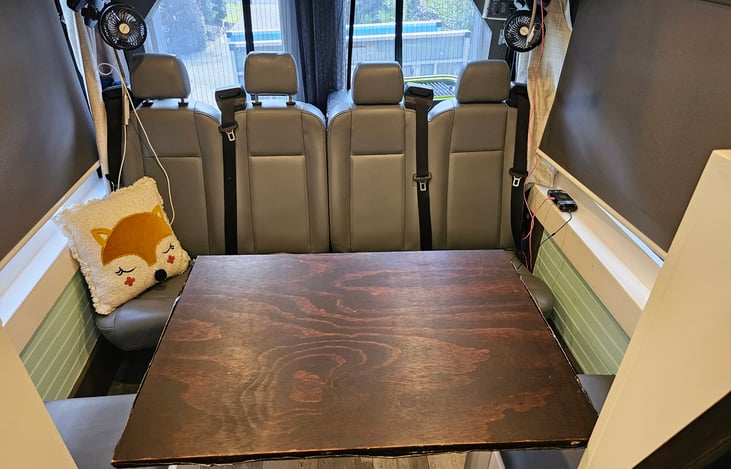 Seating/dining room/2nd bedroom.  Table swivels in all directions and comes off and becomes a bed area.