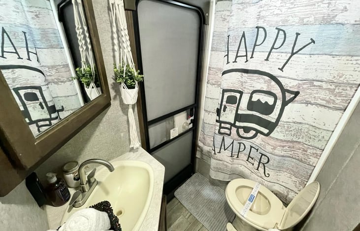 Bathroom with door to outside🏕️