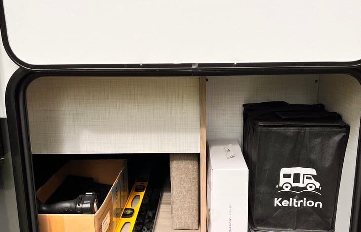 Drill for stabilizer jacks (no hand cranking!), High-def screen for back up camera, leveling blocks, wheel chocks, etc.