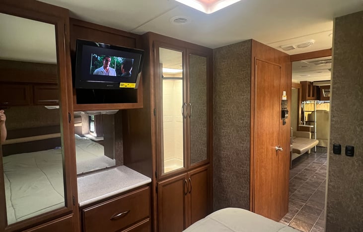 Main bedroom also has a TV with a DVD player.