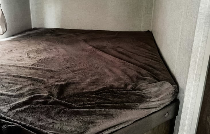 Top bunks with a window, outlets and light.