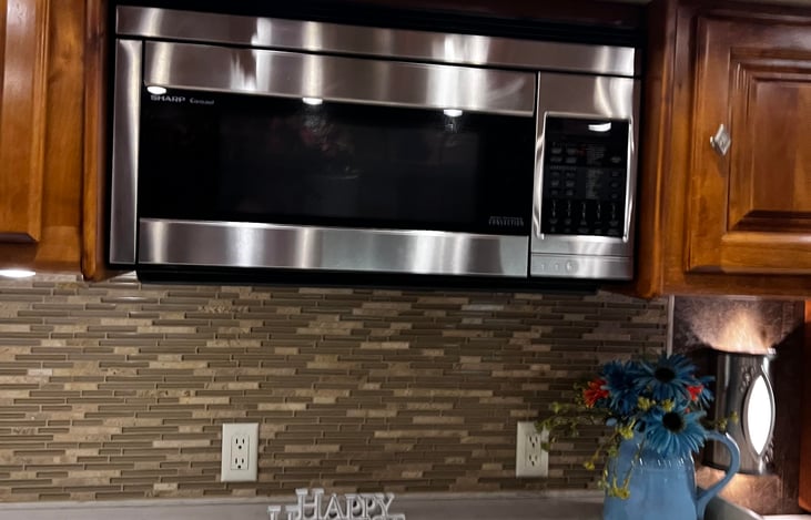 The 36GH includes a convectional microwave for versatile cooking options in the kitchen area.