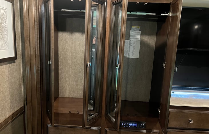 Huge closet in bedroom  Several drawers also beneath closet and tv