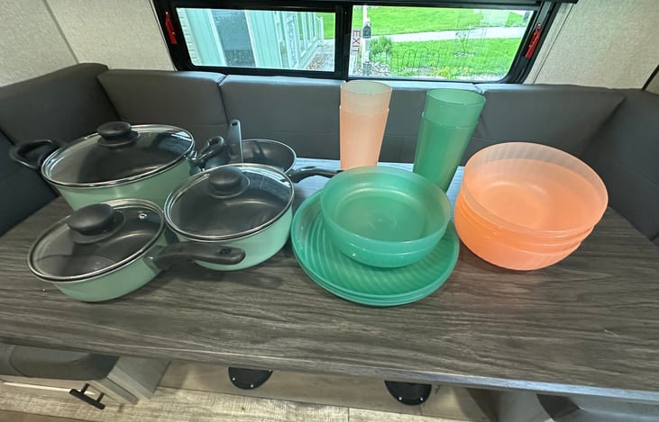 Pots, pans, plates, bowls, cups, and silverware provided.