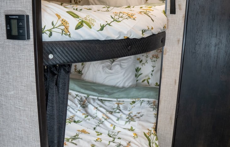 Full sized bunks with privacy curtains for sleeping for up to 4 people!