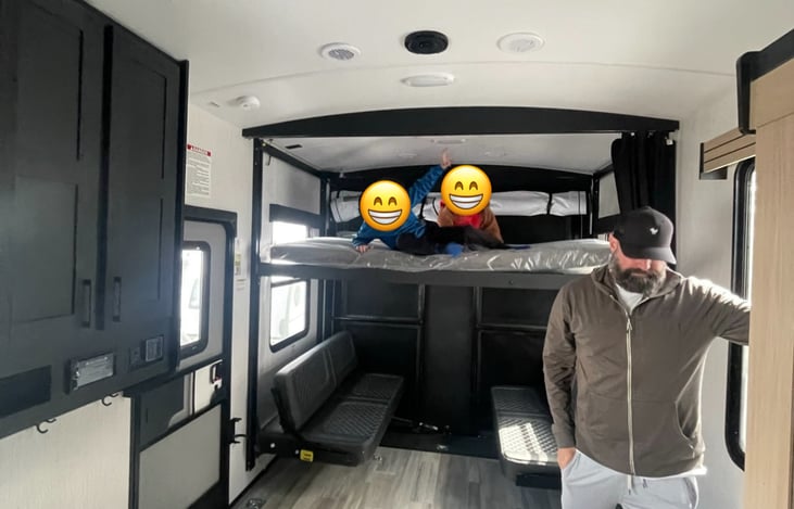 I need to update with a better picture but the two couches on bottom fold down to make a bed. Bunk on top with super comfy pad