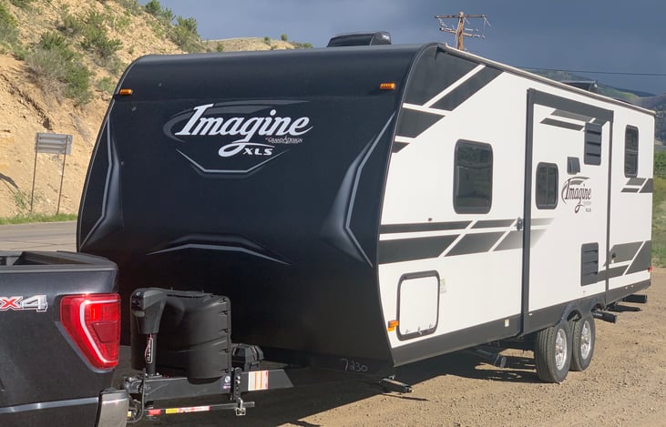 Exterior which shows 2 propane bottles.