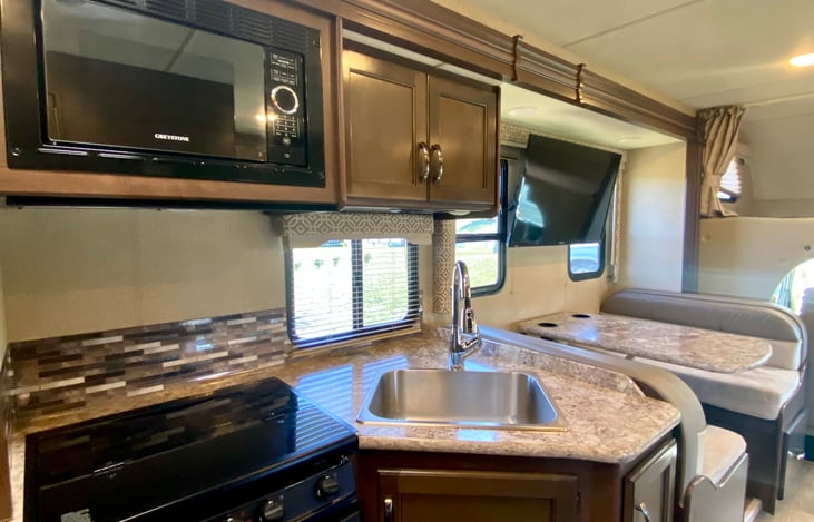 full stove, microwae and propane burners for all your cooking needs