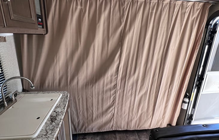 Divider to offer privacy to the front queen bed