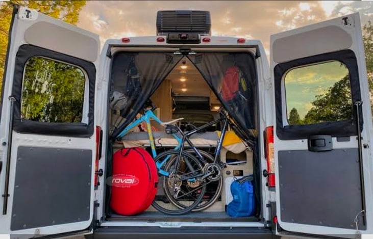 Tons of storage space in the back, even with the bed down. Our entire large E-bike even fits.