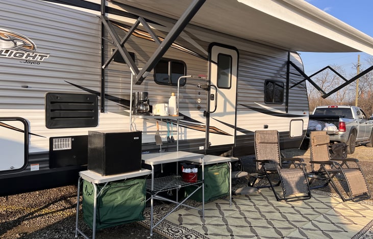 Full set up with cabela's standard camp "kitchen" with storage, a small fridge and chairs.  ( "kitchen" and fridge rented separately)