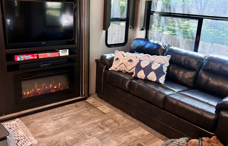 "Stay Cozy: Built-in electric fireplace and indoor surround sound for movie nights."