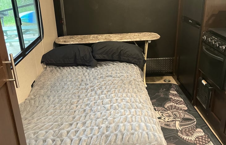 79" couch as a bed. definitely can fit two children or one adult comfortably, possibly 2 adults. The bed can also fold flat to the side wall and we throw in a full size blow up mattress, included.