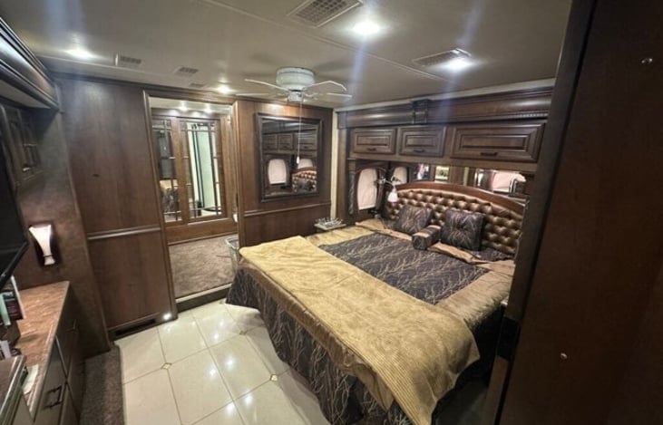 The master bedroom features an RV King Sleep Number bed with 2 zones for added comfort.  Lots of drawer space. There is a Smart TV with Bose audio to entertain you as you fall asleep