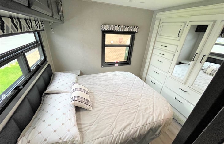 So Cozy! Wake refreshed in this Queen size master bed! Check out that beautiful wardrobe closet!