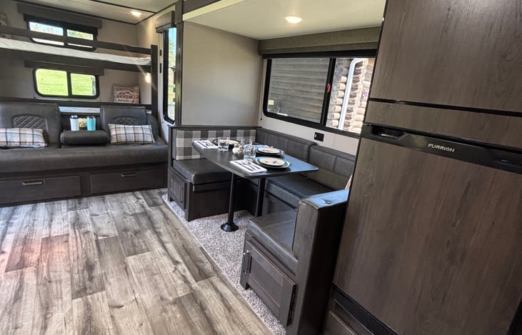 Comfy U shape Dinette with storage underneath and easy access to the storage space.