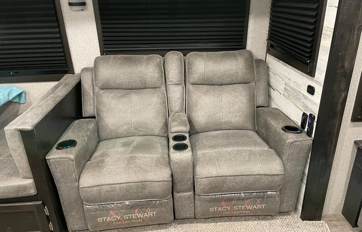 Two  recliners with heaters and massagers and cupholders.