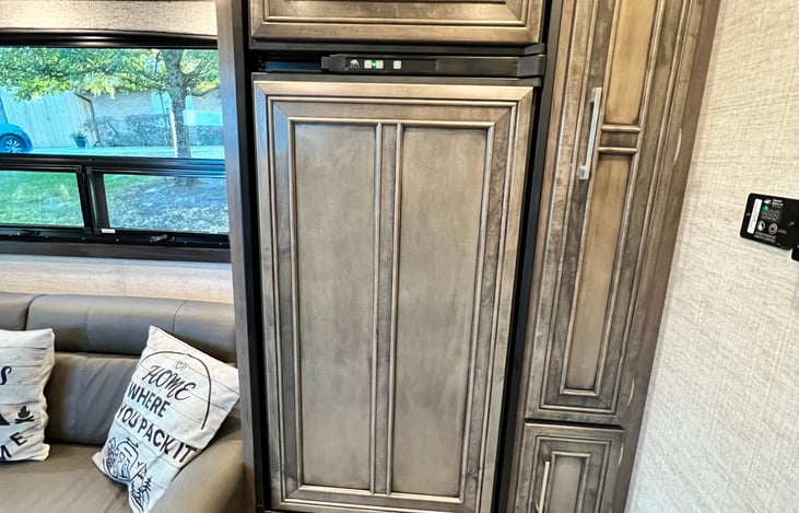 Yes, a picture of the refrigerator and cabinetry.  There is also a large pantry next to the fridge.  The workmanship is a huge upgrade.