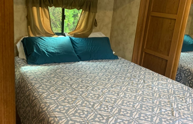 Queen bed in back bedroom