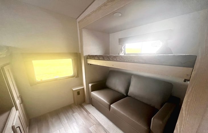 Bunk house in the rear has two over head bunks and a sleeper sofa.