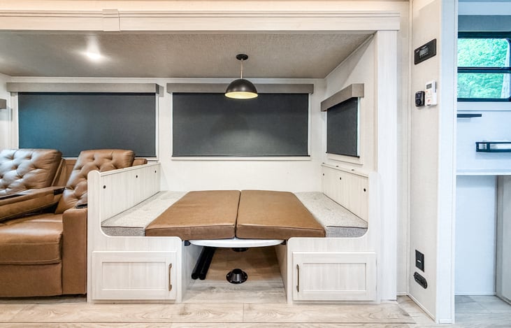 Dinette converts into a bed for extra sleeping space.