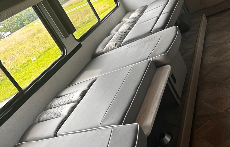 U shape dinette and sectional both fold down easily to provide sleeping quarters