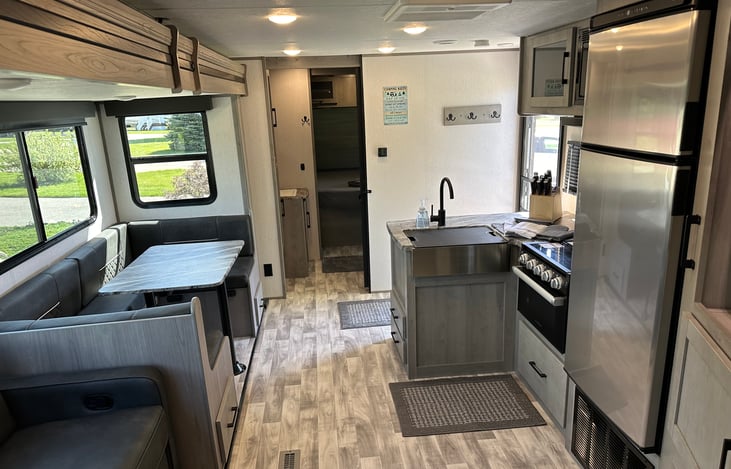 View through camper looking forward from the bunk beds in the rear.