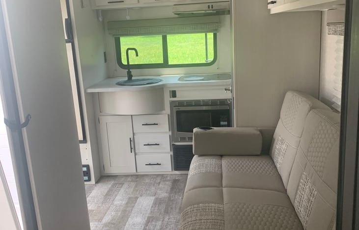 Sitting/Dining Area
*Portable Dining Table Is Stored Beneath Queen Bed In Storage Compartment.