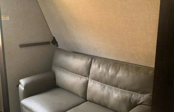 A private rear bunk house is a separate room for children or guests featuring a slide out.