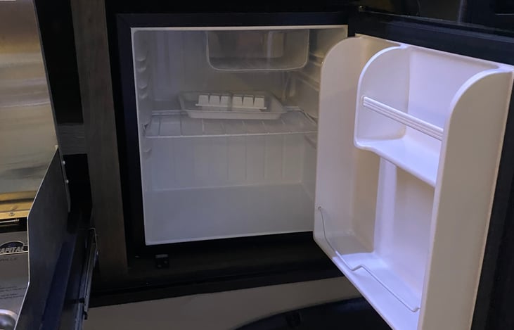 Mini Fridge in outdoor kitchen area