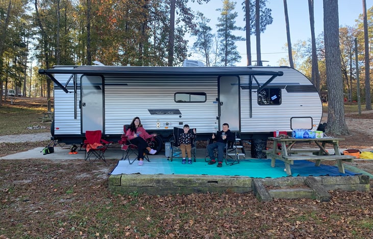 Awning lights with patio rug available for each rental. Enjoy the purple glow for an ambient evening.