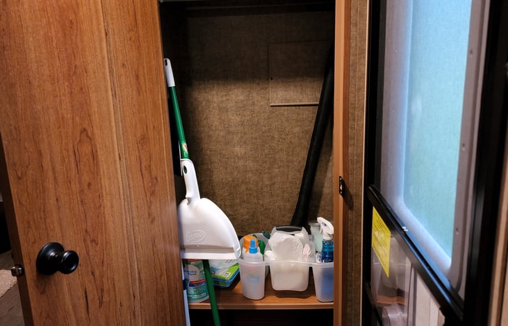 Closet with cleaning supplies