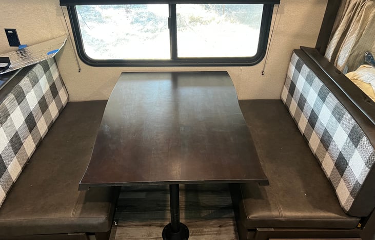 Dinette folds down into an additional bed.