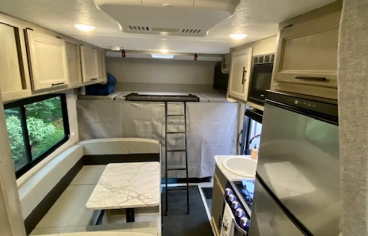 Over cab bunk, ladder, and cab privacy curtain