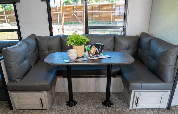 u shaped dinette offers seating for everyone and converts into a twin sized bed for additional sleeping.