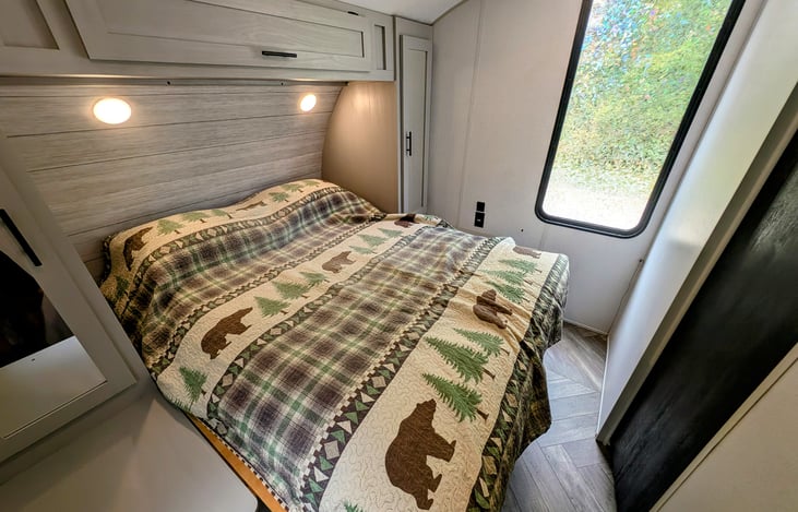 Cozy bedroom in the back with a comfortable queen bed.