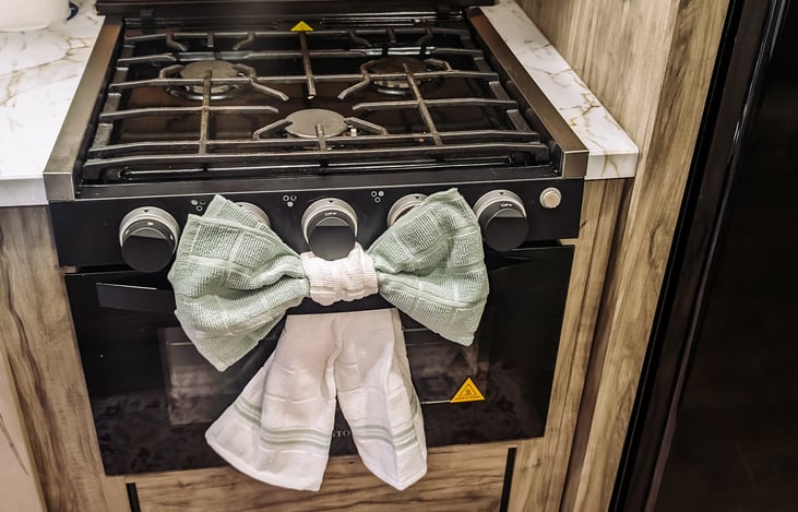 Three burner gas range and oven.