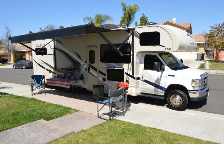Outdoor set up.  Comes with table, BBQ, chairs, mat and outdoor trash can.
