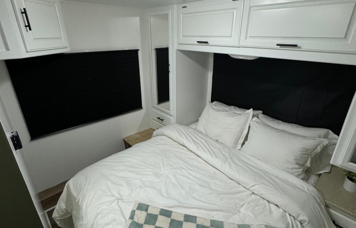 camper queen, overhead storage, dual closets, under bed storage.