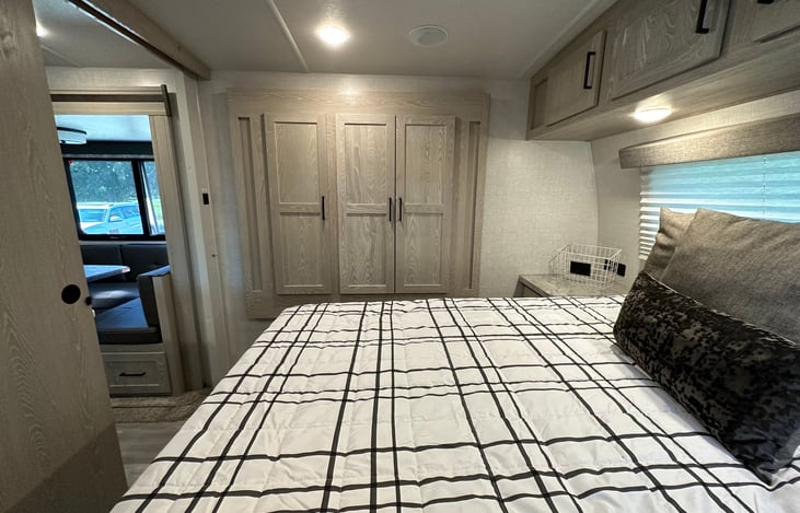 Queen bed with Hybrid Brooklyn Bedding Queen Rv mattress. COMFORTABLE!! Bedding not included but you can get a Linen's package if needed.